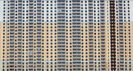 Facade of a large modern apartment building, Oktyabrskaya Embankment 40, Saint Petersburg, Russia June 2020