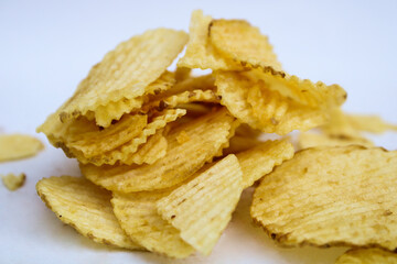 crunchy potato chips on white background