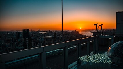 Fototapeta na wymiar Sunset scenery from rooftop observatory in Osaka