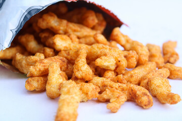 tasty crunchy snacks drop from packet