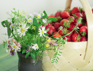 Summer still life with flowers and fresh strawberries 