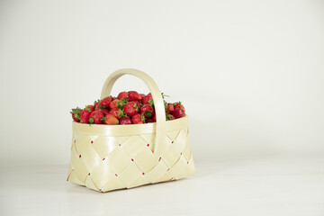 Ripe fresh red strawberries in a basket 