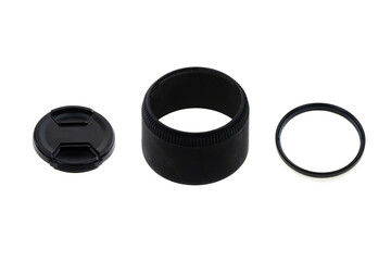 set of accessories for the camera lens hood, lens cap and lens on an isolated background