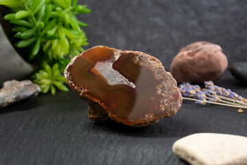 A closeup view of an agate geode rock crystal, in a still life setting.