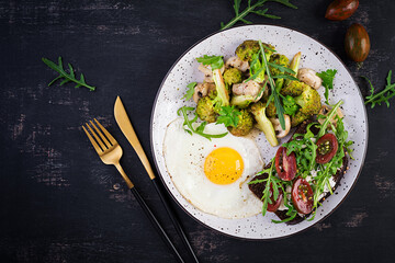 Breakfast with fried egg, broccoli, mushrooms and tomato sandwich. Healthy balanced food. Top view, overhead, copy space