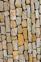 cobblestone beige background vertical drawing of old and weathered limestone stone wall