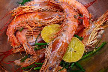 king prawns large and tasty with lemon slices preparation for cooking