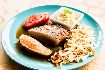 Fried pork steak in plate  , in door  Chiangmai  Thailand