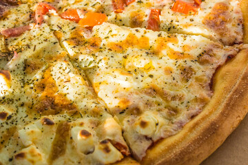 fresh cooked hot pizza close up with tomatoes, pepperoni and mushrooms in the delivery box. fast food summer concept