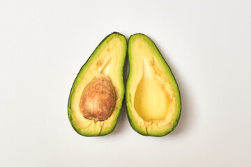 Sliced avocado on a white background.