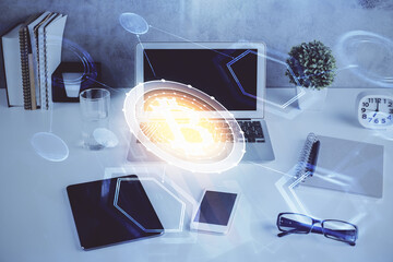 Double exposure of blockchain and crypto economy theme hologram and table with computer background....