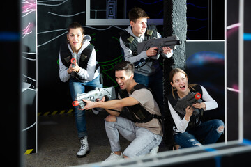 Ordinary people posing with laser guns