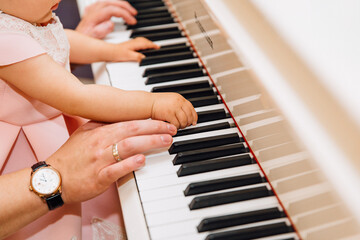 Fototapeta premium child playing piano