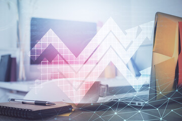 Computer on desktop with point up arrows hologram. Double exposure. Concept of success.