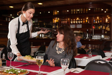 Dissatisfied female client with waitress