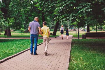 Fototapeta na wymiar family walking in the park