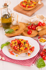 Friselle with tomatoes and mais.
