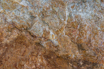 colored rocky stones of natural origin, background for walls and wallpapers, highlighted texture of the material, natural color blocks