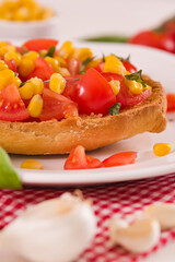 Friselle with tomatoes and mais.
