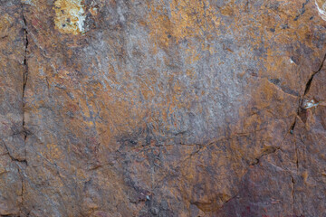 colored rocky stones of natural origin, background for walls and wallpapers, highlighted texture of the material, natural color blocks