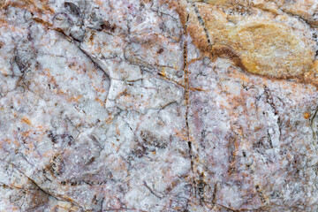 colored rocky stones of natural origin, background for walls and wallpapers, highlighted texture of the material, natural color blocks