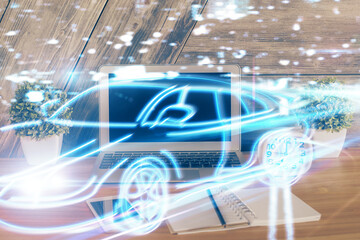 Desktop computer background in office with automobile hologram drawing. Multi exposure. Tech concept.