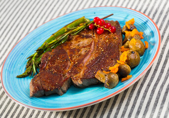 Photography of plate with beef entrecote with mushroom and asparagus