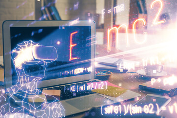 Obraz premium Desktop computer background and formula hologram writing. Double exposure. Education concept.