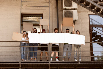 Diverse group of people protesting with blank sign. Protest against human rights, abuse of freedom,...