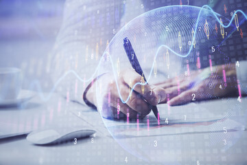 Financial trading chart multi exposure with man desktop background.