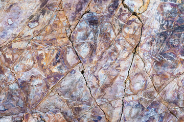 colored rocky stones of natural origin, background for walls and wallpapers, highlighted texture of the material, natural color blocks