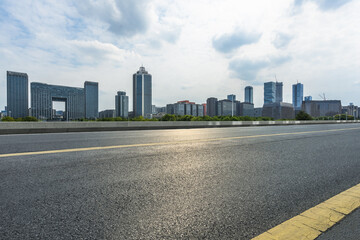 Asphalt road and modern city commercial buildings in Beijing, China