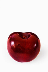 Sweet cherry. Macro photo. Ripe sweet cherries. Bigarreau. Dark red cherry berries close-up. White background