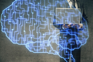 Businessman with computer background with brain theme hologram. Concept of brainstorm. Multi exposure.