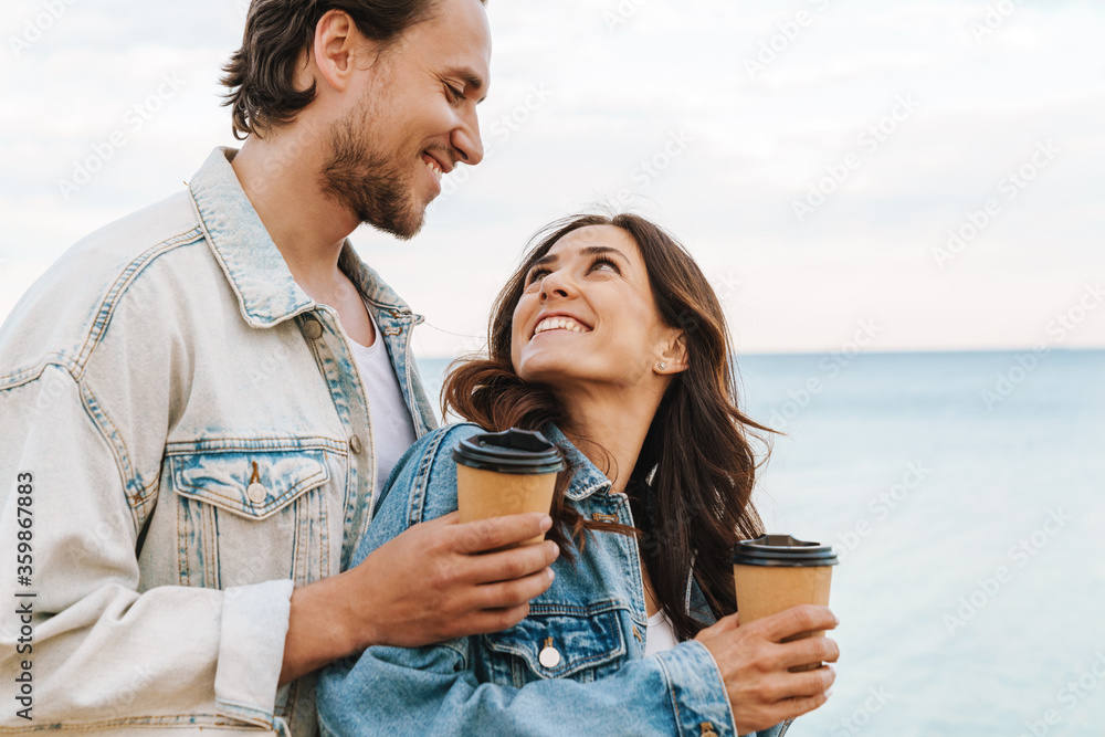 Wall mural beautiful happy young couple in love spending time together