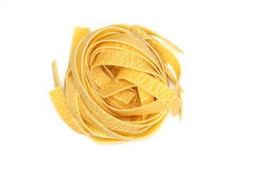 Italian pasta Fettuccine in form nest isolated on white background. Top view. One piece