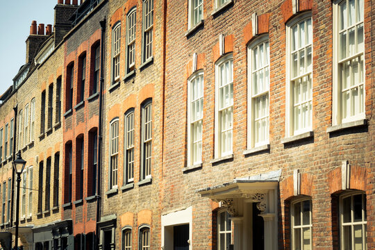 London- Historic brick townhouse buildings in Spitalfields area of East London