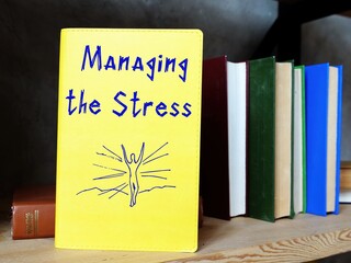Motivation concept about Managing the Stress with inscription on the sheet.