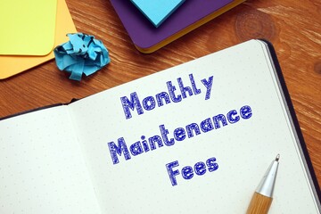 Financial concept meaning Monthly Maintenance Fees with inscription on the sheet.