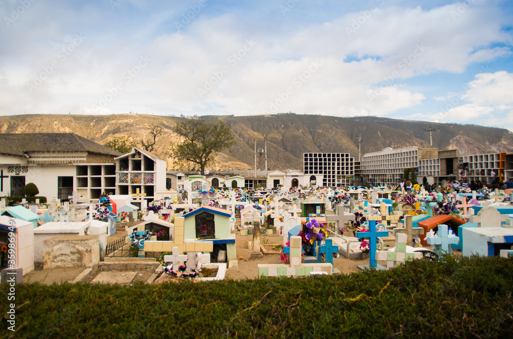 Wall mural quito, ecuador- may 23, 2017: view of cemetery san antonio de pichincha, showing typical catholic gr