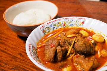 Thai food Hunglae ​​curry on wood background 