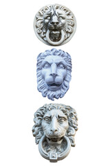 Fototapeta na wymiar three plaster sculptures of lion heads to decorate the facade of the building isolated on a white background