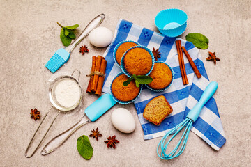 Homemade cupcakes with cinnamon, star anise and fresh mint. Bakery concept, set of ingredients for...