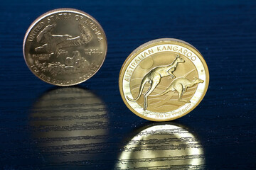 Golden Age: 1 ounce Kangaroo Australian gold coin and American Eagle gold coin in the background.