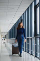 Pretty young female passenger at the airport (shallow DOF; color toned image)