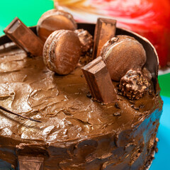 Different beautiful chocolate macaron cake, close up