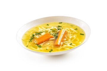 Chicken duck turkey or beef soup with homemade noodles carrot and celery herbs in white plate isolated on white