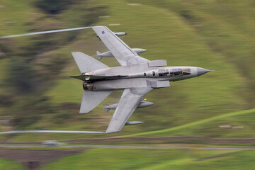 RAF (Royal Air Force) Panavia Tornado GR4 Fighter Bomber and reconnaissance jet flying low level in...