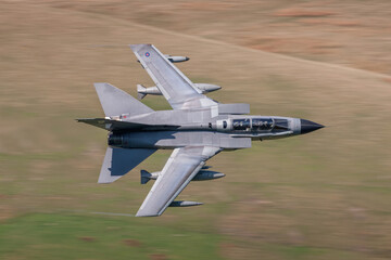 RAF (Royal Air Force) Panavia Tornado GR4 Fighter Bomber and reconnaissance jet flying low level in...
