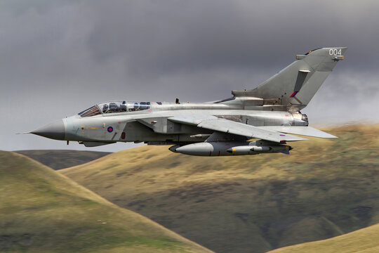 RAF (Royal Air Force) Panavia Tornado GR4 Fighter Bomber and reconnaissance jet flying low level in the UK, Cumbria, Wales and Scotland.  